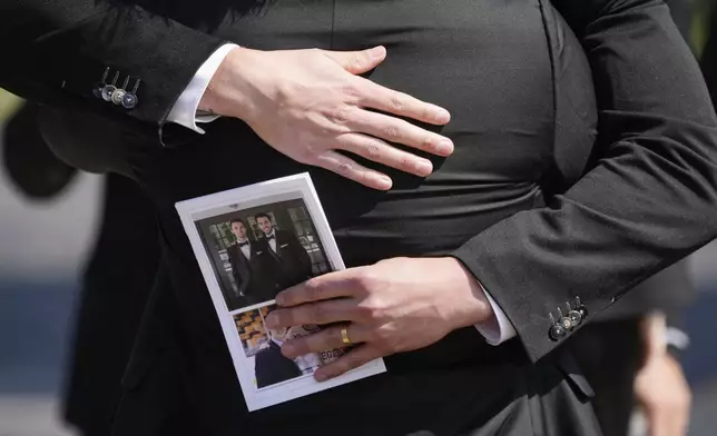 Mourners depart following the funeral for Columbus Blue Jackets hockey player John Gaudreau and his brother Matthew Gaudreau at St. Mary Magdalen Catholic Church in Media, Pa., Monday, Sept. 9, 2024. (AP Photo/Matt Rourke)