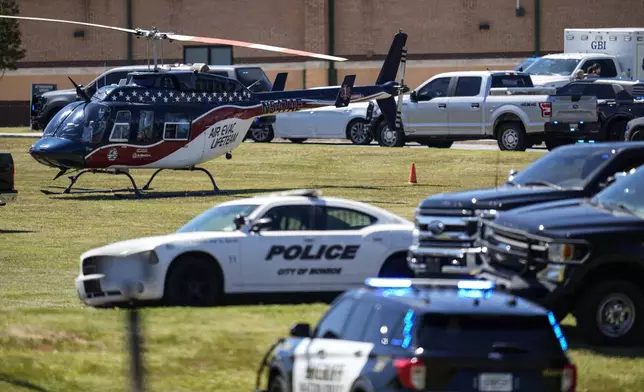 A medical helicopter is seen in front of Apalachee High School after a shooting at the school Wednesday, Sept. 4, 2024, in Winder, Ga. (AP Photo/Mike Stewart)