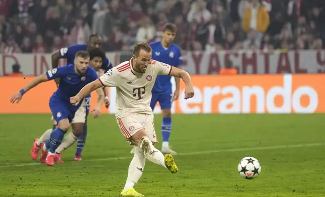 Bayern's Harry Kane scores his sides 7th goal and his 4th of the game from the penalty spot during the Champions League opening phase soccer match between Bayern Munich and GNK Dinamo at the Allianz Arena in Munich, Germany Tuesday, Sept. 17, 2024. (AP Photo/Matthias Schrader)