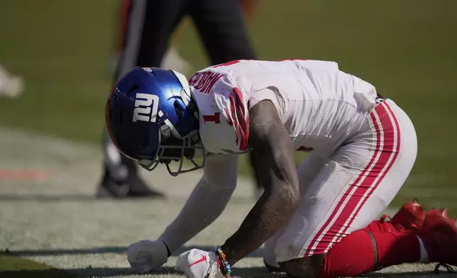 New York Giants wide receiver Malik Nabers (1) reacts after missing a pass on fourth down against the Washington Commanders late in the second half of an NFL football game in Landover, Md., Sunday, Sept. 15, 2024. (AP Photo/Matt Slocum)