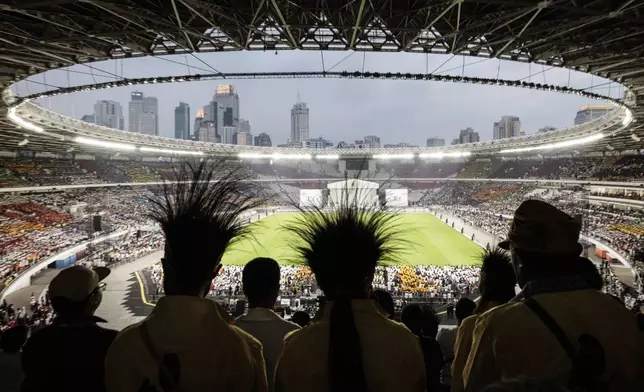 Catholic faithful attend a holy mass led by Pope Francis at the Gelora Bung Karno Stadium, in Jakarta, Thursday, Sept. 5, 2024. (Yasuyoshi Chiba/Pool Photo via AP)