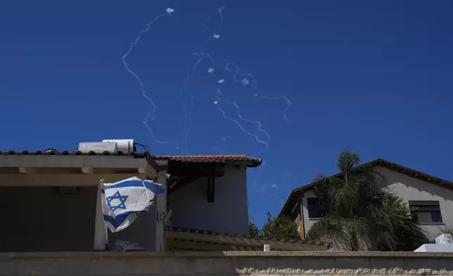 The Israeli Iron Dome air defense system fires to intercept rockets that were launched from Lebanon, as seen from Safed, northern Israel, on Saturday, Sept. 28, 2024. (AP Photo/Baz Ratner)