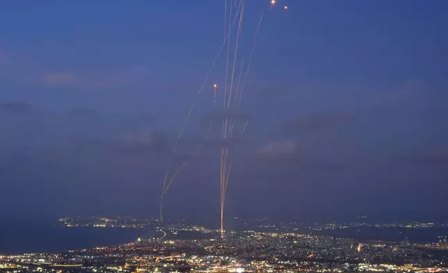 Israeli Iron Dome air defense system fires to intercept rockets that were launched from Lebanon, as seen from Haifa, northern Israel, Monday, Sept. 23, 2024. (AP Photo/Baz Ratner)