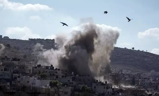 An explosion is seen during an Israeli military operation in the West Bank city of Jenin, Thursday, Sept. 5, 2024. (AP Photo/Majdi Mohammed)