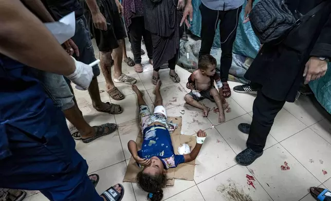 Palestinian children wounded in the Israeli bombardment of the Gaza Strip are treated in a hospital in Deir al-Balah, Thursday, Sept. 5, 2024. (AP Photo/Abdel Kareem Hana)