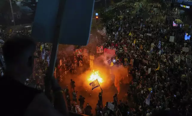 People protest against Prime Minister Benjamin Netanyahu's government and call for the release of hostages held in the Gaza Strip by the Hamas militant group, in Tel Aviv, Israel, Saturday, Sept. 7, 2024. (AP Photo/Ariel Schalit)