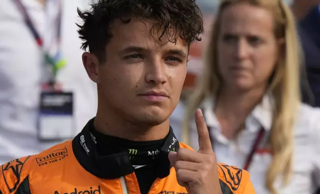 McLaren driver Lando Norris of Britain celebrates his pole position after qualifying session ahead of the Formula One Italian Grand Prix race at the Monza racetrack, in Monza, Italy, Saturday, Aug. 31, 2024. (AP Photo/Luca Bruno)