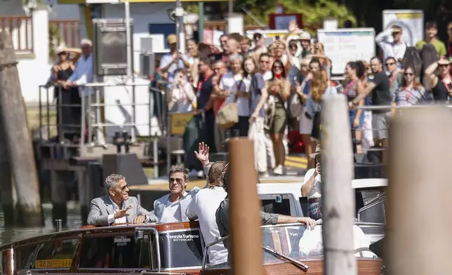 George Clooney, left, and Brad Pitt upon arrival for the press conference of the film 'Wolfs' during the 81st edition of the Venice Film Festival in Venice, Italy, on Sunday, Sept. 1, 2024. (Photo by Vianney Le Caer/Invision/AP)