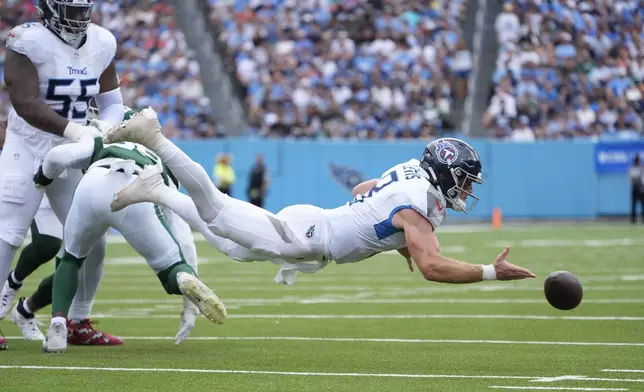 Tennessee Titans quarterback Will Levis (8) fumbles the ball in the first half of an NFL football game against the New York Jets in Nashville, Tenn., on Sunday, Sept. 15, 2024. (AP Photo/George Walker IV)