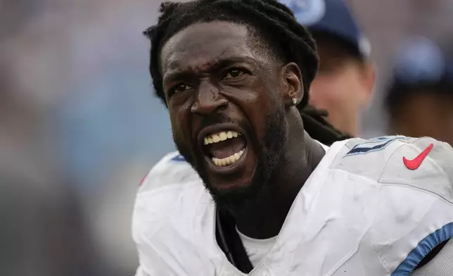 Tennessee Titans wide receiver Calvin Ridley (0) celebrates after scoring a touchdown in the second half of an NFL football game against the New York Jets in Nashville, Tenn., on Sunday, Sept. 15, 2024. (AP Photo/George Walker IV)