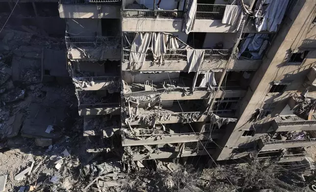 Damaged buildings at the site of the assassination of Hezbollah leader Hassan Nasrallah in Beirut's southern suburbs, Sunday, Sept. 29, 2024. (AP Photo/Hassan Ammar)