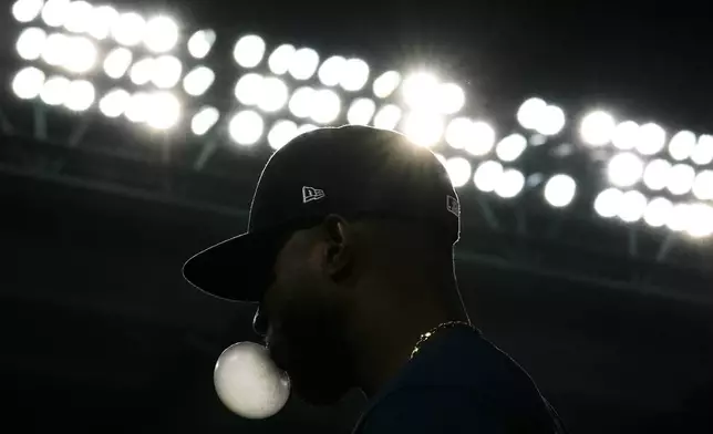 Seattle Mariners right fielder Victor Robles walks back to the dugout after the fourth inning of a baseball game against the Los Angeles Angels in Anaheim, Calif., Saturday, Aug. 31, 2024. (AP Photo/Ashley Landis)