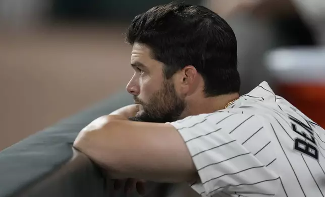 Chicago White Sox's Andrew Benintendi looks out from the dugout during the ninth inning of a baseball game against the New York Mets on Saturday, Aug. 31, 2024, that saw the team tie the franchise season record of 106 losses in Chicago. (AP Photo/Charles Rex Arbogast)