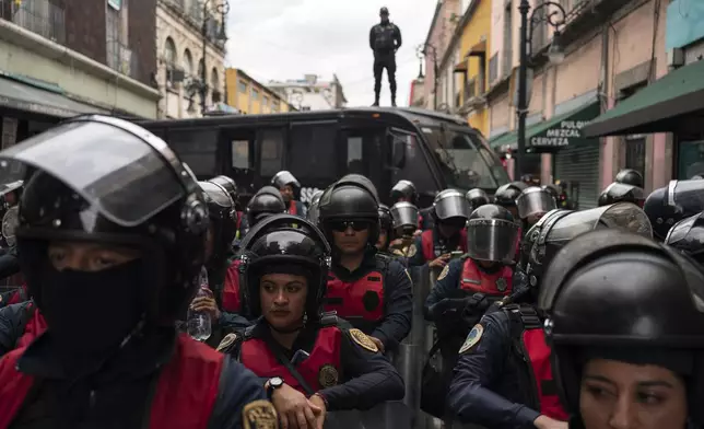 Police guard the Mexico City Congress in expectation of protests against judicial reform, Thursday, Sept. 12, 2024. (AP Photo/Felix Marquez)