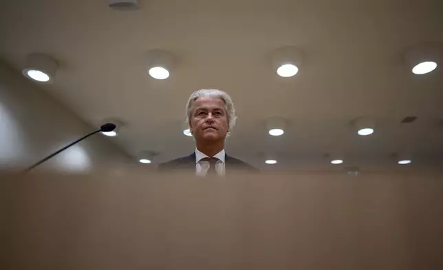 Anti-Islam lawmaker Geert Wilders, is seated at the high security court at Schiphol, near Amsterdam, Netherlands, Monday, Sept. 2, 2024, where two Pakistani men go on trial, likely in their absence, on charges of threatening anti-Islam lawmaker Wilders, whose Party for Freedom won national elections last year. (AP Photo/Peter Dejong)