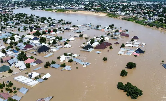 Houses are partially submerged following a dam collapse in Maiduguri, Nigeria, Tuesday, Sept 10, 2024. (AP Photos/ Musa Ajit Borno)