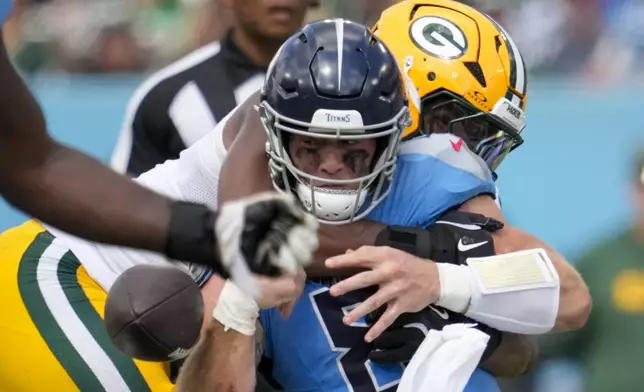 Green Bay Packers' Kingsley Enagbare causes a fumble as he sacks Tennessee Titans quarterback Will Levis during the second half of an NFL football game Sunday, Sept. 22, 2024, in Nashville, Tenn. (AP Photo/George Walker IV)