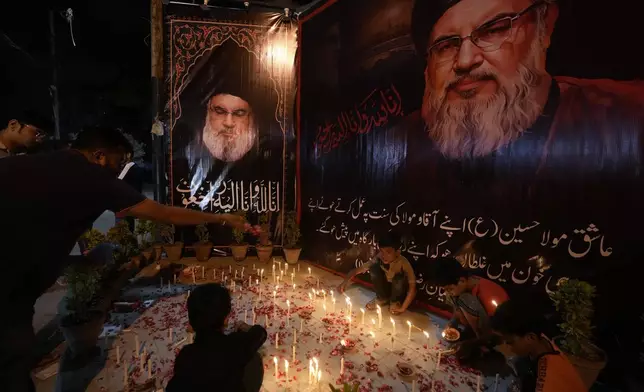 Shiite Muslims light candles during a protest against the killing of Hezbollah leader Hassan Nasrallah, in Karachi, Pakistan, Saturday, Sept. 28, 2024. (AP Photo/Fareed Khan)