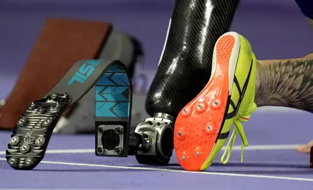 Vinicius Goncalves Rodrigues of Brazil prepares to compete in the men's 100 m. T63 at the 2024 Paralympics, Sunday, Sept. 1, 2024, in Paris, France. (AP Photo/Christophe Ena)