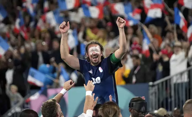 France's captain Frederic Villeroux celebrate after scoring the decisive penalty and winning the blind football gold medal match at the 2024 Paralympics, Saturday, Sept. 7, 2024, in Paris, France. (AP Photo/Christophe Ena)