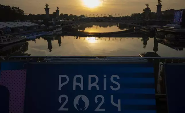 View of the Seine river where the triathlon competition has been cancelled, during the 2024 Paralympics, Sunday, Sept. 1, 2024, in Paris, France. (AP Photo/Emilio Morenatti)