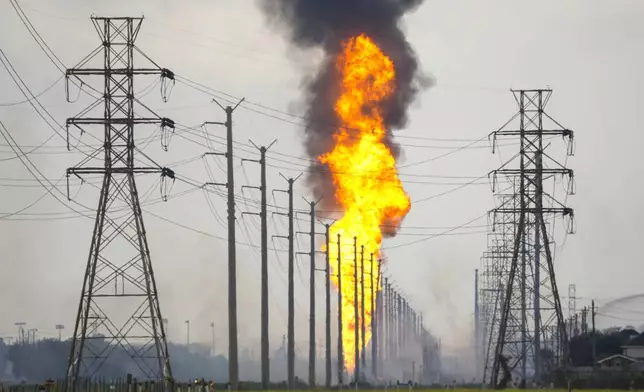 A pipeline with a giant plume of fire burns Monday, Sept. 16, 2024, in La Porte, Texas. (Brett Coomer/Houston Chronicle via AP)