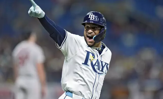 Tampa Bay Rays' Jose Siri celebrates after hitting a solo home run off Boston Red Sox starting pitcher Nick Pivetta during the fifth inning of a baseball game Tuesday, Sept. 17, 2024, in St. Petersburg, Fla. (AP Photo/Chris O'Meara)