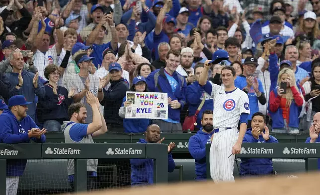 Chicago Cubs starting pitcher Kyle Hendricks tips his cap to the Wrigley Field fans after being pulled in the eighth inning of a baseball game against the Cincinnati Reds on Saturday, Sept. 28, 2024, in Chicago. (AP Photo/Charles Rex Arbogast)