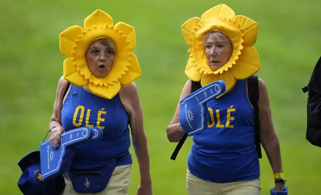 Fans are seen during a Solheim Cup golf tournament foursomes match at Robert Trent Jones Golf Club, Friday, Sept. 13, 2024, in Gainesville, Va. (AP Photo/Chris Szagola)