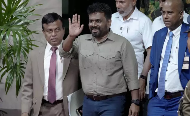 Marxist lawmaker Anura Kumara Dissanayake waves as he departs the election commission office after winning the presidential election in Colombo, Sri Lanka, Sunday, Sept. 22, 2024. (AP Photo/Eranga Jayawardena)