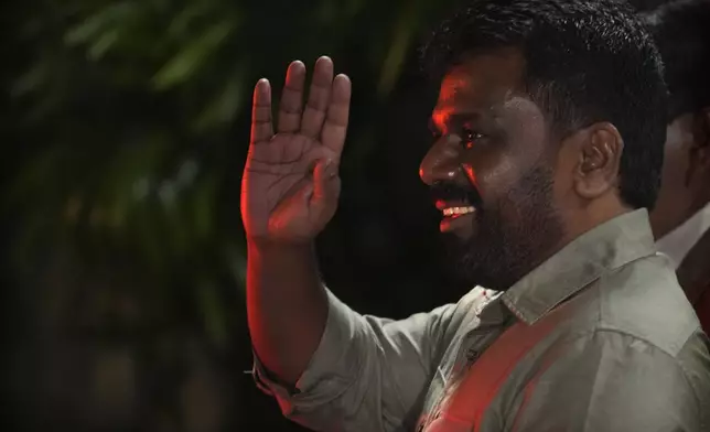 Marxist lawmaker Anura Kumara Dissanayake waves as he leaves from the election commission office after winning Sri Lankan presidential election, in Colombo, Sri Lanka, Sunday, Sept. 22, 2024. (AP Photo/Rajesh Kumar Singh)