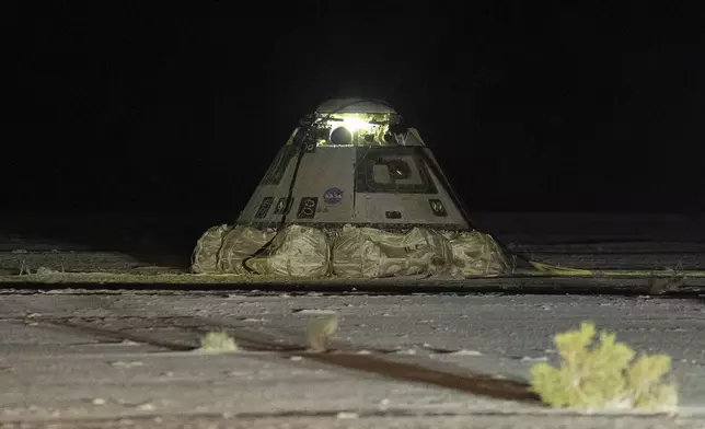 The empty Boeing Starliner capsule sits at White Sands Missile Range in New Mexico, late Friday, Sept. 6, 2024, after undocking from the International Space Station. (Boeing via AP)