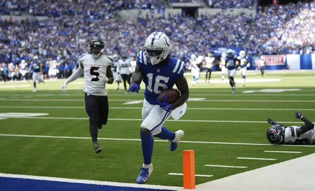 Indianapolis Colts wide receiver Ashton Dulin (16) runs tot he end zone for a touchdown during the second half of an NFL football game against the Houston Texans, Sunday, Sept. 8, 2024, in Indianapolis. (AP Photo/Michael Conroy)