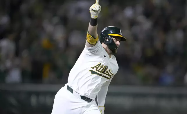 Oakland Athletics' Seth Brown (15) celebrates his game-winning single against the Detroit Tigers during the 13th inning of a baseball game Friday, Sept. 6, 2024, in Oakland, Calif. Oakland won 7-6. (AP Photo/Tony Avelar)