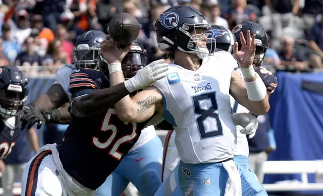 Chicago Bears defensive end Darrell Taylor (52) creates a fumble sack of Tennessee Titans quarterback Will Levis during the second half of an NFL football game Sunday, Sept. 8, 2024, in Chicago. (AP Photo/Nam Y. Huh)