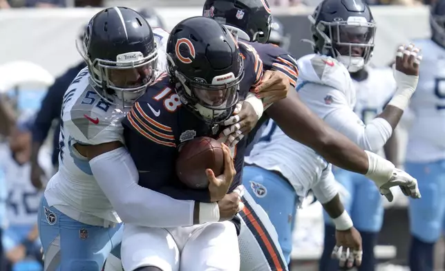 Tennessee Titans linebacker Harold Landry III, left, sacks Chicago Bears quarterback Caleb Williams during the second half of an NFL football game Sunday, Sept. 8, 2024, in Chicago. (AP Photo/Nam Y. Huh)