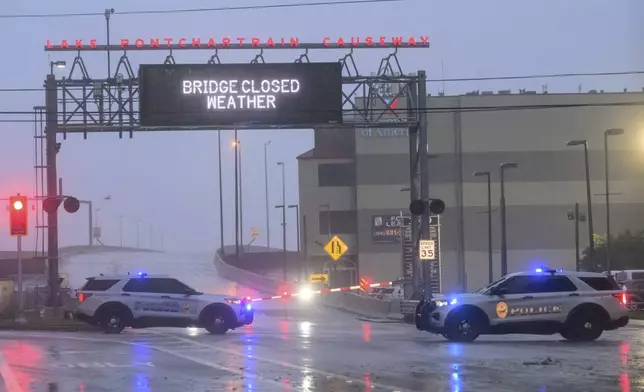 The entrance to Lake Ponchartrain Causeway is closed due to Hurricane Francine in Metairie, La., Wednesday, Sept. 11, 2024. The causeway is the longest continuous bridge over water in the world. (AP Photo/Matthew Hinton)