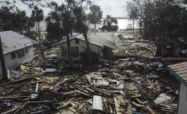 Destruction to the Faraway Inn Cottages and Motel is seen in the aftermath of Hurricane Helene, in Cedar Key, Fla., Friday, Sept. 27, 2024. (AP Photo/Stephen Smith)