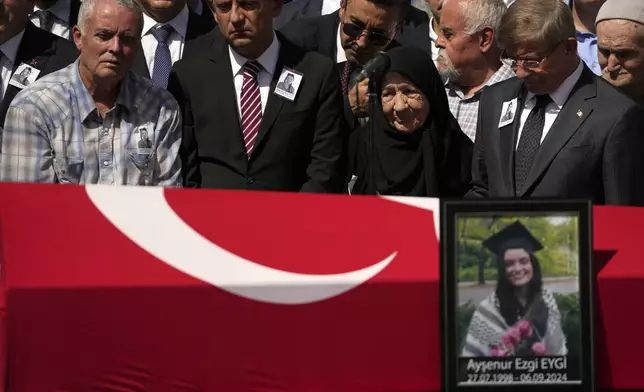 Mehmet, left. the father of Aysenur Ezgi Eygi, a 26 year-old Turkish-American activist killed by the Israeli military, attends prayers during his daughter's funeral outside the central mosque of Didim, Turkey, Saturday, Sept. 14, 2024,(AP Photo/Khalil Hamra)