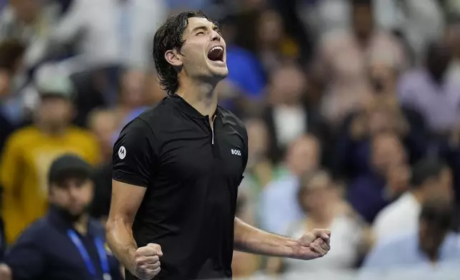 Taylor Fritz, of the United States, reacts after defeating Frances Tiafoe, of the United States, during the men's singles semifinals of the U.S. Open tennis championships, Friday, Sept. 6, 2024, in New York. (AP Photo/Seth Wenig)