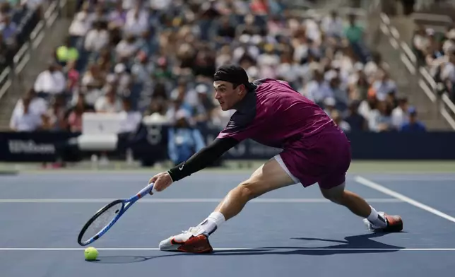 Jack Draper, of Great Britain, misses a shot from Botic van De Zandschulp, of the Netherlands, during the third round of the U.S. Open tennis championships, Saturday, Aug. 31, in New York. 2024. (AP Photo/Adam Hunger)