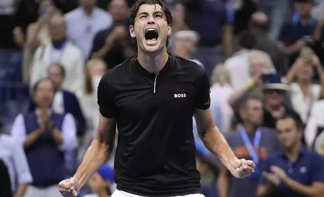 Taylor Fritz, of the United States, reacts after defeating Frances Tiafoe, of the United States, during the men's singles semifinal of the U.S. Open tennis championships, Friday, Sept. 6, 2024, in New York. (AP Photo/Frank Franklin II)