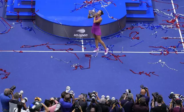 Aryna Sabalenka, of Belarus, kisses the trophy after winning the women's singles final of the U.S. Open tennis championships against Jessica Pegula, of the United States, Saturday, Sept. 7, 2024, in New York. (AP Photo/Kirsty Wigglesworth)