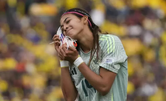 Mexico's Montserrat Saldivar celebrates scoring her side's second goal against Cameroon during a U-20 Women's World Cup soccer match in Bogota, Colombia, Saturday, Aug. 31, 2024. (AP Photo/Fernando Vergara)