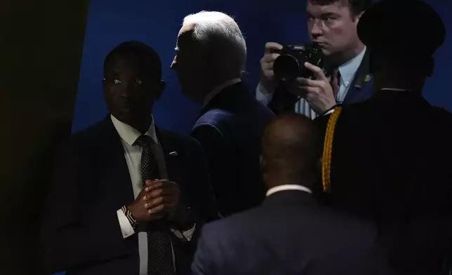 United States President Joe Biden, rear center, leaves the General Assembly Hall after addressing the 79th session of the United Nations General Assembly, Tuesday, Sept. 24, 2024, at UN headquarters. (AP Photo/Julia Demaree Nikhinson)