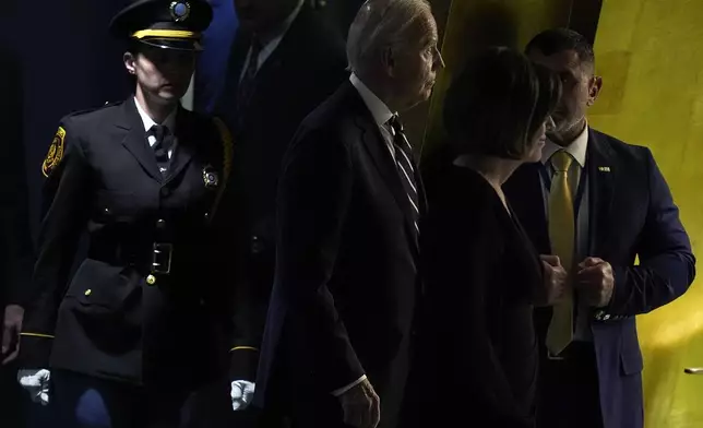 United States President Joe Biden, center, arrives to address the 79th session of the United Nations General Assembly, Tuesday, Sept. 24, 2024, at UN headquarters. (AP Photo/Julia Demaree Nikhinson)