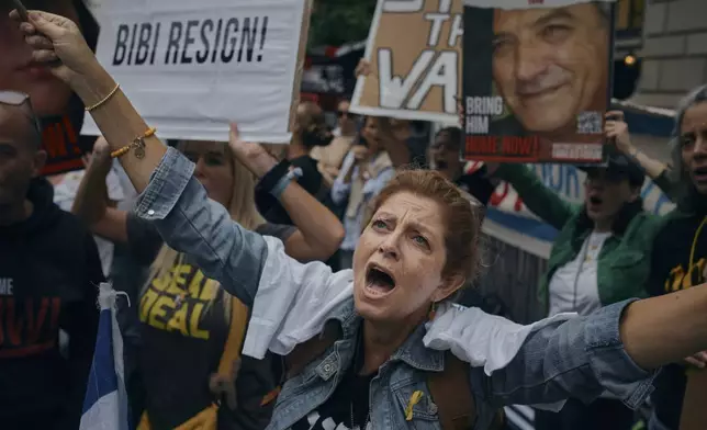 People protest against Prime Minister of Israel Benjamin Netanyahu during the 79th session of the United Nations General Assembly, in New York, on Friday, Sept. 27, 2024. (AP Photo/Andres Kudacki)