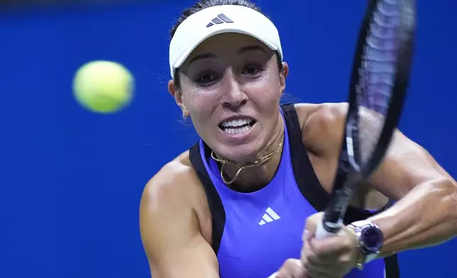 Jessica Pegula, of the United States, returns to Iga Świątek, of Poland, during the quarterfinals of the U.S. Open tennis championships, Wednesday, Sept. 4, 2024, in New York. (AP Photo/Eduardo Munoz Alvarez)