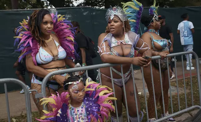 Revelers gather during the West Indian Day Parade on Monday, Sept. 2, 2024, in the Brooklyn borough of New York. (AP Photo/Andres Kudacki)