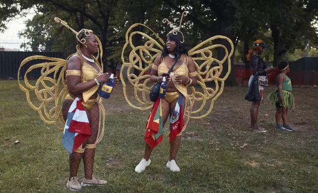 Revelers gather during the West Indian Day Parade on Monday, Sept. 2, 2024, in the Brooklyn borough of New York. (AP Photo/Andres Kudacki)